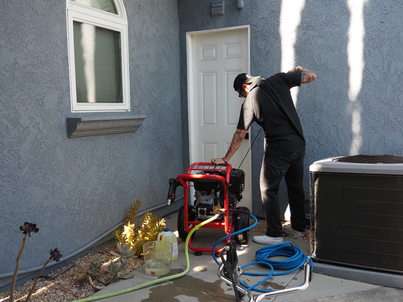 Dylan starting the pressure washer